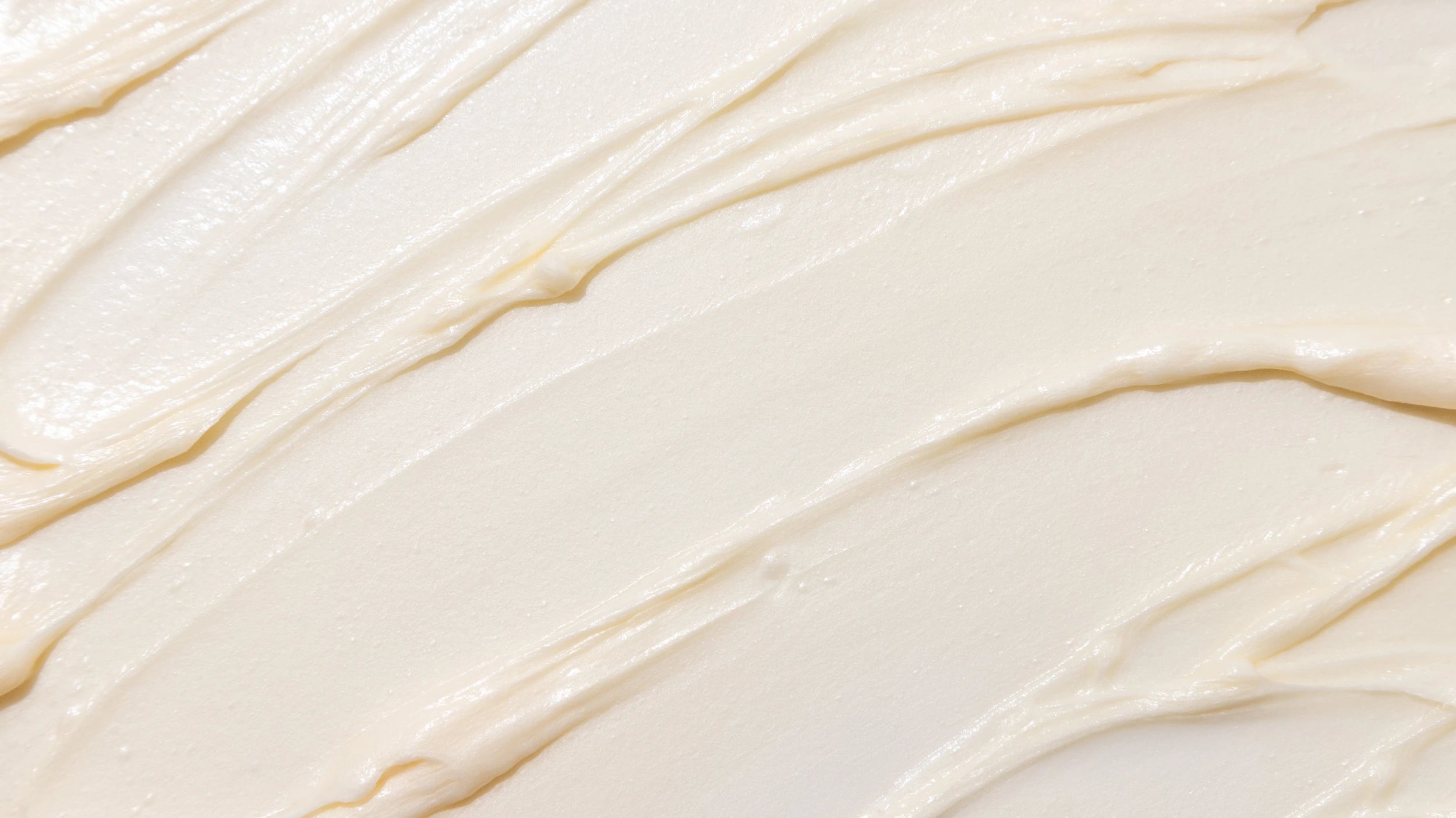 Close-up of smooth, beige cream texture